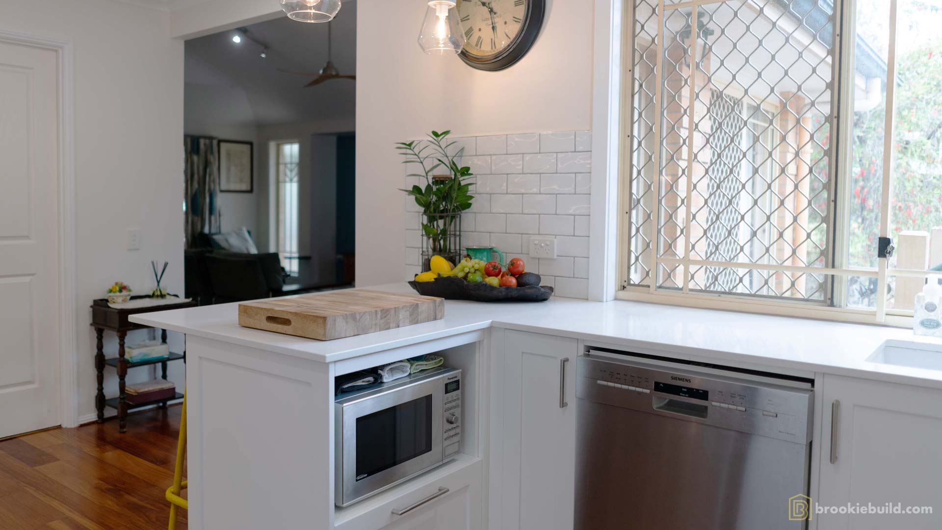 Kenmore entertainers kitchen with wet bar in a townhouse by Brookie Build