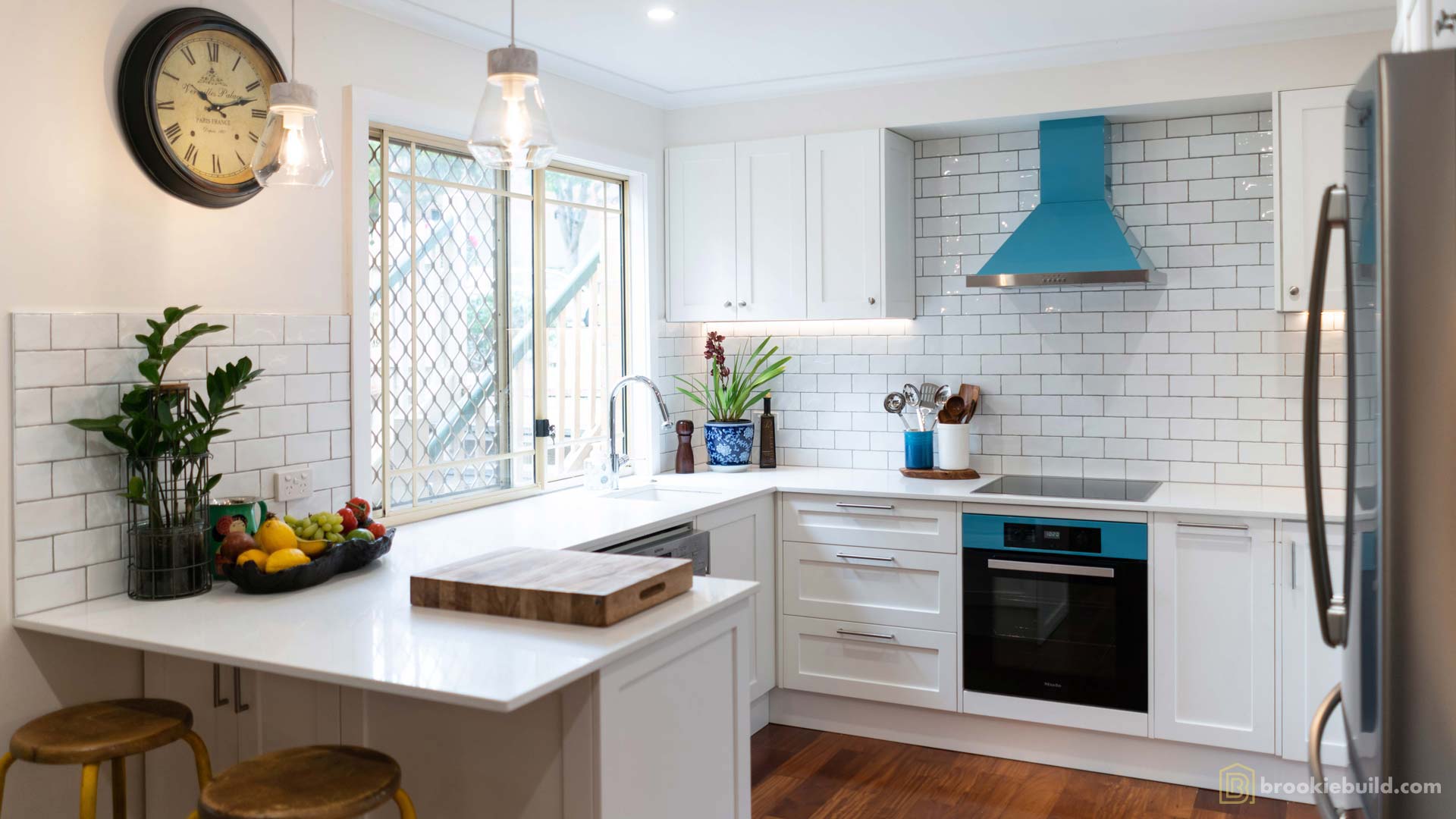 Kenmore entertainers kitchen with wet bar in a townhouse by Brookie Build