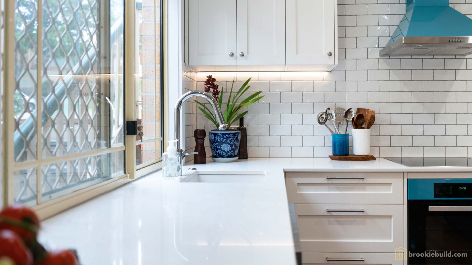 Kenmore entertainers kitchen with wet bar in a townhouse by Brookie Build