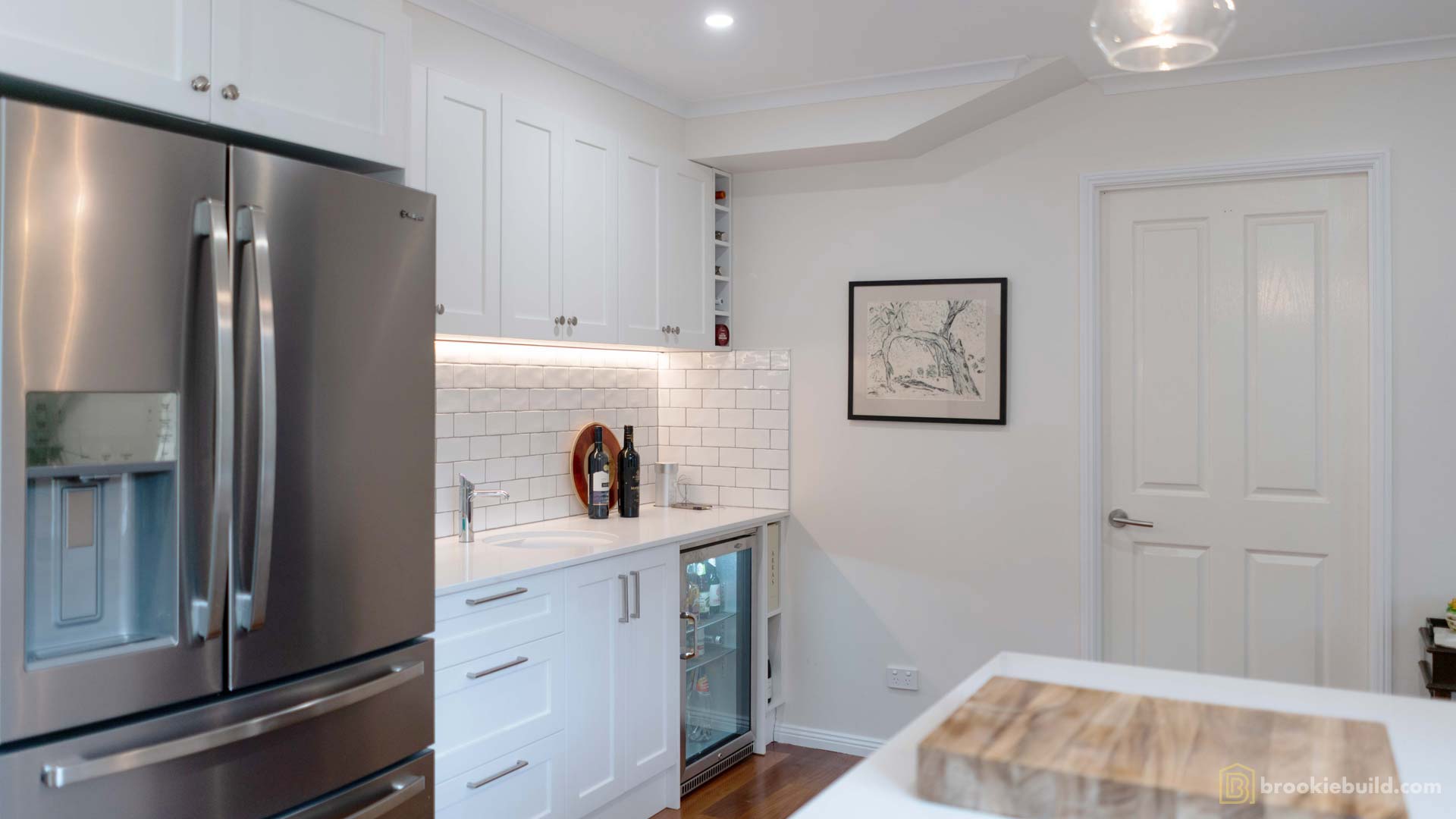 Kenmore entertainers kitchen with wet bar in a townhouse by Brookie Build